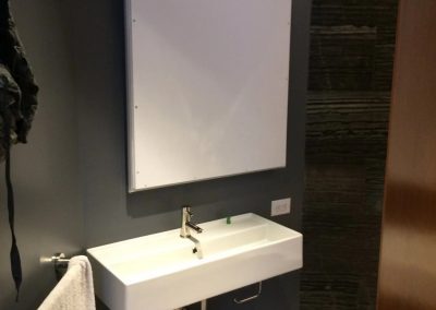 tile floor installation-hotel room with a sink and a board