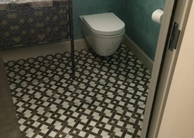 tile floor installation- close up of a toilet floor
