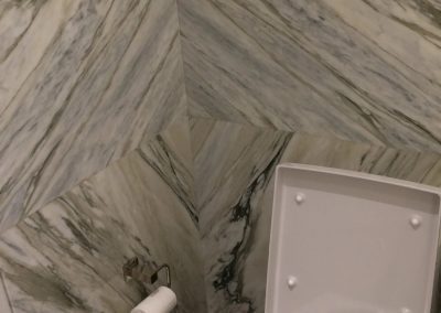 tile floor installation-toilet with toilet paper and trashcan